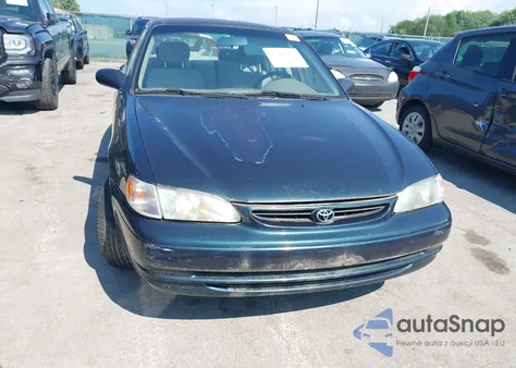 1999 Toyota Corolla Ce из США, поврежденный, VIN 2T1BR12E1XC119351